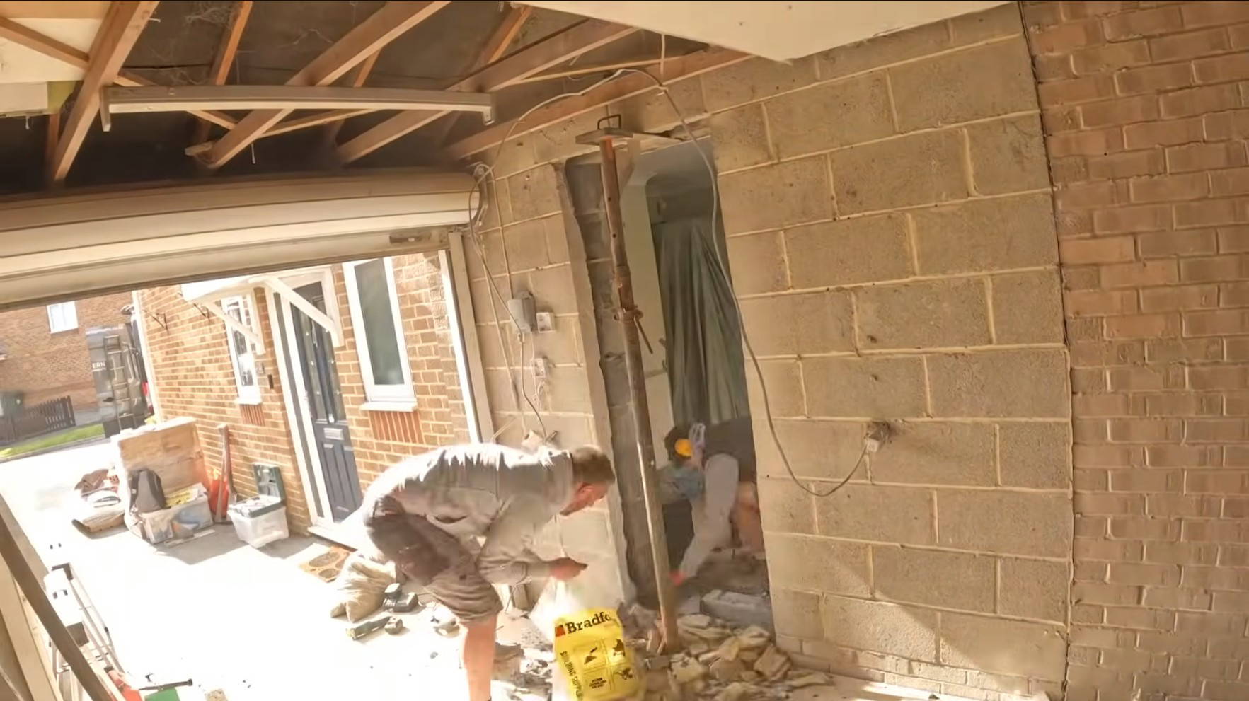 Marking the wall before forming the knockthrough for the Exminster garage conversion