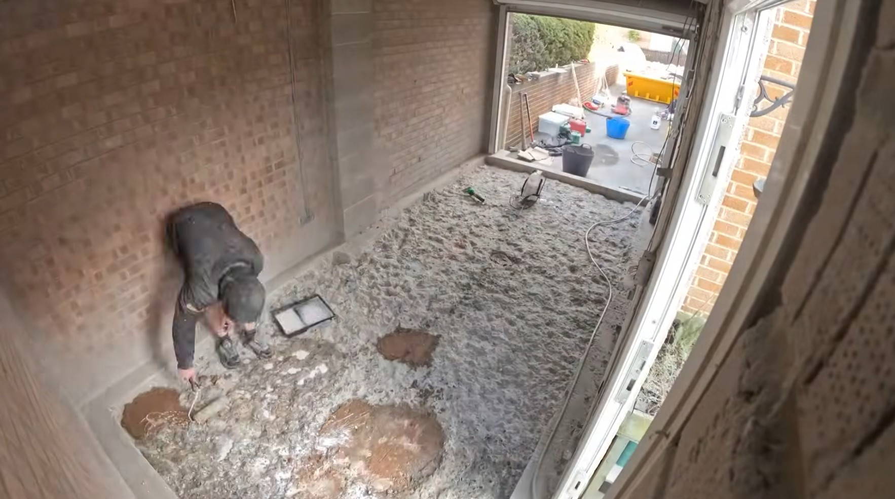 Floor preparation and levelling during an Exminster garage conversion