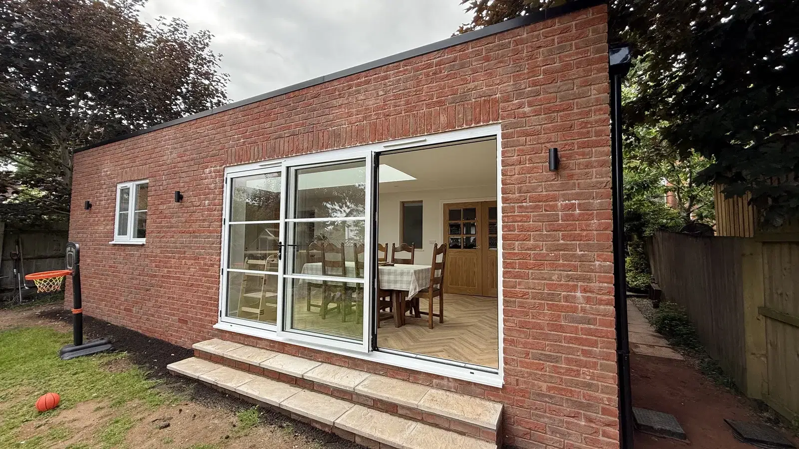 Home extensions: completed brick rear extension and garden-facing glazing